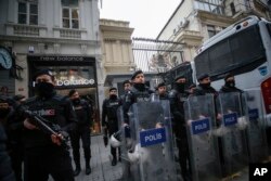 FILE - Riot police stand outside the Netherlands consulate as the supporters of Turkey's President Recep Tayyip Erdogan stage a protest in Istanbul, March 11, 2017.