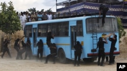 Members of India's Karnataka state police counter terrorism group display their skills during an event in Bangalore, India, June 30, 2011. 