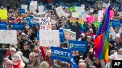 Thousands of opponents of Indiana Senate Bill 101, the Religious Freedom Restoration Act, gathered on the lawn of the Indiana State House to rally against the legislation, March 28, 2015. 