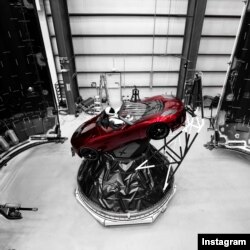 "Starman" sits behind the wheel of a Tesla roadster in this photo posted to the Instagram account of Elon Musk, head of the Tesla car company and founder of SpaceX.
