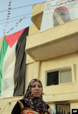 Samud Kraja outside her family home in the village of Saffa near Ramallah.