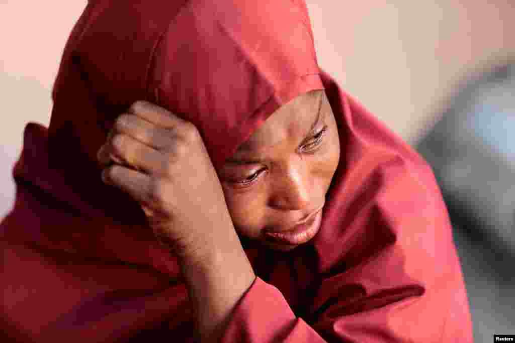 The mother of Muhammad Bello, one the students who was abducted by gunmen, reacts in Kankara, in northwestern Katsina state, Nigeria, De. 14, 2020.