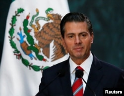 FILE - Mexico's President Enrique Pena Nieto gives a speech at the National Palace in Mexico City, Nov. 21 2017.