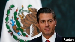 FILE - Mexico's President Enrique Pena Nieto gives a speech at the National Palace in Mexico City, Nov. 21 2017.