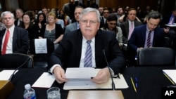 John Tefft of Va., who is to be the new U.S. Ambassador to Russia, arrives to testify before the Senate Foreign Relations Committee on Capitol Hill in Washington, July 29, 2014.