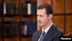 Tổng thống Syria Bashar al-Assad trong cuộc phỏng vấn với đài truyền hình CCTV của Trung Quốc tại Damascus, ngày 23/9/2013.