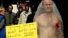 FILE - An activist dressed as a condom protests in Hong Kong, Dec. 1, 2004, the lack of adequate sex education in Hong Kong schools and said the level of HIV infections will rise dramatically because many in Hong Kong are having unprotected sex.