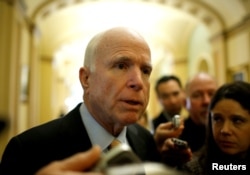 FILE - Senator John McCain, an Arizona Republican, speaks to reporters as he arrives for a Republican policy luncheon on Capitol Hill in Washington, Feb. 14, 2017.