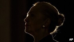 U.S. Secretary of State Hillary Clinton silhouetted by stage light, University of the Western Cape, South African, Aug. 8, 2012.