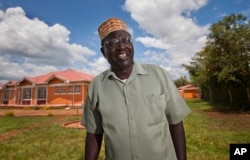 FILE - Malik Obama, half-brother of President Barack Obama, seen in this Nov. 4, 2012, is attending Wednesday's final presidential debate, as a guest of Republican nominee Donald Trump.