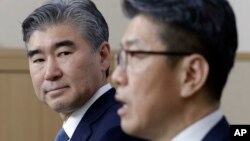 U.S. State Department's Special Representative for North Korea Policy Sung Kim, left, watches as his South Korean counterpart Kim Hong-kyun speaks during a joint press conference after their meeting to exchange views on North Korea's fifth nuclear test conducted on last Friday at the Foreign Ministry in Seoul, South Korea, Tuesday, Sept. 13, 2016.