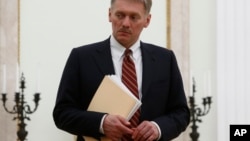 FILE - Russian President Vladimir Putin's spokesman Dmitry Peskov is seen at the Kremlin in Moscow, Russia, March 27, 2017.