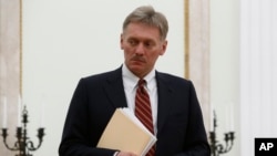 FILE - Russian President Vladimir Putin's spokesman Dmitry Peskov at the Kremlin in Moscow, March 27, 2017.