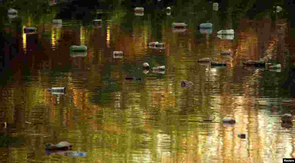 Trash is seen on the polluted El Claro creek on Earth Day in Tigre, Argentina, April 22, 2017.