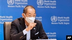 In this handout photo provided by the World Health Organization Regional Office for the Western Pacific, WHO Regional Director for the Western Pacific Dr. Takeshi Kasai, speaks in Manila, Philippines on Thursday, Nov. 11, 2021. World Health Organization o