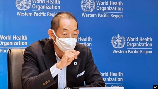 In this handout photo provided by the World Health Organization Regional Office for the Western Pacific, WHO Regional Director for the Western Pacific Dr. Takeshi Kasai, speaks in Manila, Philippines on Nov. 11, 2021. AP