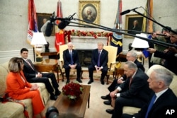 President Donald Trump accompanied by Vice President Mike Pence, meets with congressional leaders including House Minority Leader Nancy Pelosi of Calif., left, House Speaker Paul Ryan of Wis., Senate Majority Leader Mitch McConnell of Ky., Senate Minority Leader Chuck Schumer of N.Y., and Defense Secretary Jim Mattis in the Oval Office of the White House, Dec. 7, 2017, in Washington.
