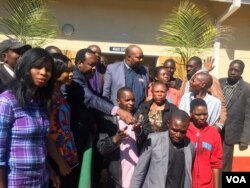 Sikhala and some of the MDC supporters outside the Bikita Magistrates Court ...