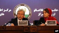 Tadamichi Yamamoto, the U.N. special representative for Afghanistan, left, and Danielle Bell, director of human rights of the United Nations Assistance Mission in Afghanistan, speak during a press conference in Kabul, Feb. 15, 2018.