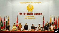 South Asian leaders, from left, Afghanistan President Ashraf Ghani, Bangladeshi prime Minister Sheikh Hasina, Bhutanese Prime Minister Tshering Tobgay, Indian Prime Minister Narendra Modi, Maldives President Abdulla Yameen, Nepalese Prime Minister Sushil Koirala, Pakistani Prime Minister Nawaz Sharif and Sri Lankan President Mahinda Rajapaksa stand during the 18th summit of the South Asian Association for Regional Cooperation (SAARC) in Katmandu, Nepal, Nov. 26, 2014. 