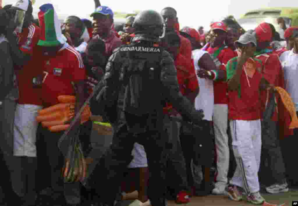 Equatorial Guinea's special police forces try to control Equatorial Guinea fans inside Estadio de Bata "Bata Stadium", which will host the opening match and ceremony for the African Nations Cup, in Bata January 21, 2012. Picture taken January 21, 2012. RE