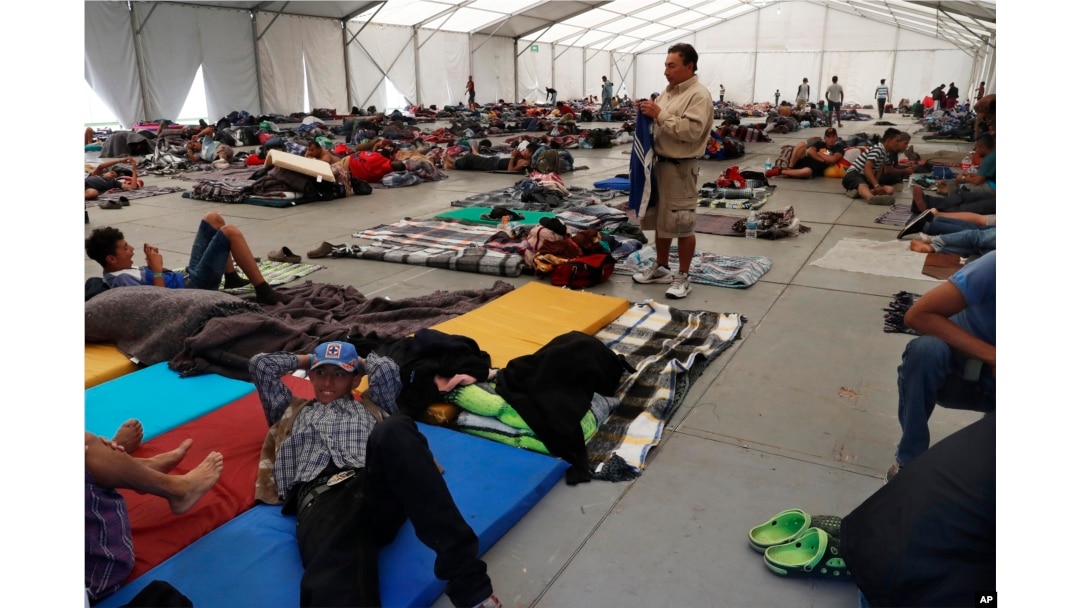 Central American migrants settle in a shelter at the Jesus Martinez stadium in Mexico City, in Mexico City, Jan. 28, 2019.