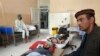 Wounded men receive treatment in a hospital after a Taliban attack in the Nahrin district of Baghlan province north of Kabul, Afghanistan, June 29, 2019.