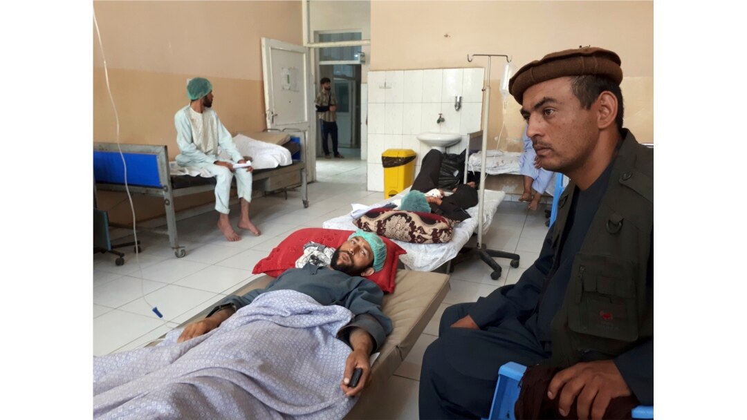 Wounded men receive treatment in a hospital after a Taliban attack in the Nahrin district of Baghlan province north of Kabul, Afghanistan, June 29, 2019.