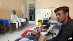 Wounded men receive treatment in a hospital after a Taliban attack in the Nahrin district of Baghlan province north of Kabul, Afghanistan, June 29, 2019.