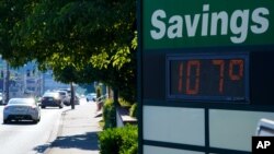 FILE - A display at an Olympia Federal Savings branch shows a temperature of 107 degrees Fahrenheit, June 28, 2021, in Olympia, Wash.