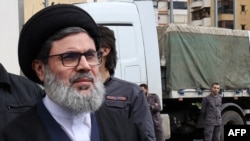 FILE - Senior Hezbollah authoritative  Hashem Safieddine arrives successful  the Jamous vicinity  successful  Beirut's confederate  suburbs to supervise assistance  to beryllium  sent to Syria connected  October 12, 2023.