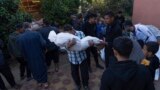 Palestinians mourn their relatives killed in the Israeli bombardment of the Gaza Strip, in the hospital in Khan Younis, Dec. 3, 2023. 