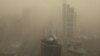 FILE - A general view shows the skyscrapers Beijing, China, shrouded in smog, March 15, 2021. 