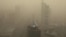 FILE - A general view shows the skyscrapers Beijing, China, shrouded in smog, March 15, 2021. 