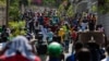 People displaced by gang violence march in protest of the gangs in Port-au-Prince, Haiti, on March 1, 2025. The aid group Doctors Without Borders said on March 6 that makeshift camps for the displaced are in danger of disease outbreaks.