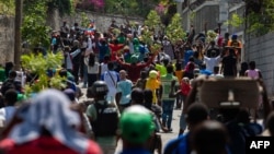 People displaced by gang violence march in protest of the gangs in Port-au-Prince, Haiti, on March 1, 2025. The aid group Doctors Without Borders said on March 6 that makeshift camps for the displaced are in danger of disease outbreaks.