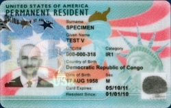 This undated image from U.S. Citizenship and Immigration Services shows the front of a sample "green card," formally known as a permanent resident card.