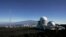 FILE - This Oct. 25, 2009, photo shows the Mauna Loa Observatory atmospheric research facility on the island of Hawaii. The volcano of Mauna Kea is seen in the background.