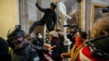 FILE - Pro-Trump protesters storm the U.S. Capitol to contest the certification of the 2020 U.S. presidential election results by the U.S. Congress, at the U.S. Capitol Building in Washington, Jan. 6, 2021. 