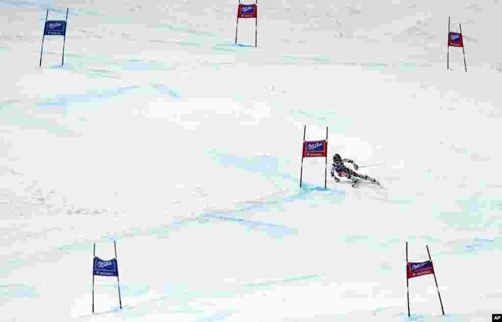 Anna Fenninger of Austria speeds down the course on her way to win the alpine ski in the women&#39;s World Cup giant slalom at the World Cup finals in Meribel, France.