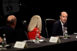 Secretary of Labor Eugene Scalia, right, participates in a discussion, May 20, 2020, in Orlando, Fla. The discussion was held with hospitality and tourism industry leaders regarding plans for re-opening during the coronavirus outbreak.