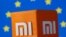 ស្លាក​សញ្ញា Xiaomi ដែល​បោះពុម្ព​ជា 3D នៅខាងមុខ​ទង់​សហភាព​អឺរ៉ុប នៅ​ថ្ងៃទី៣០ ខែកញ្ញា ឆ្នាំ២០២១។