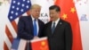 FILE - Then-President Donald Trump poses for a photo with Chinese President Xi Jinping during a meeting on the sidelines of the G20 summit in Osaka, Japan, on June 29, 2019.