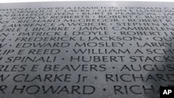 This sliver of the fallen listed on the Vietnam Veterans Memorial in Washington, D.C., illustrates the panoply of names - from "Ballegooyen" to "Wojcik" - in the America of today.