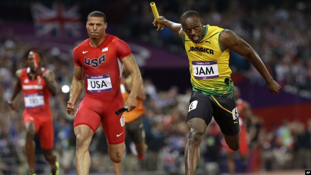 Jamaica's Usain Bolt crosses the finish line ahead of United States' Ryan Bailey to win the men's 4x100-meter relay final during the athletics in the Olympic Park during the 2012 Summer Olympics, Saturday, Aug. 11, 2012, in London.