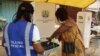 A woman casts her ballot on election day in Accra, Ghana, Dec. 7, 2020. (Photo: Peter Clottey, Isaah Ali / VOA)