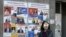 A woman walks past election posters on March 29, 2017 in Yerevan, ahead of April 2 parliamentary elections.