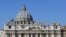 Tapestries portraying new proclaimed saints hang from the facade of St. Peter's Basilica during a canonization ceremony in St. Peter's Square at the Vatican.