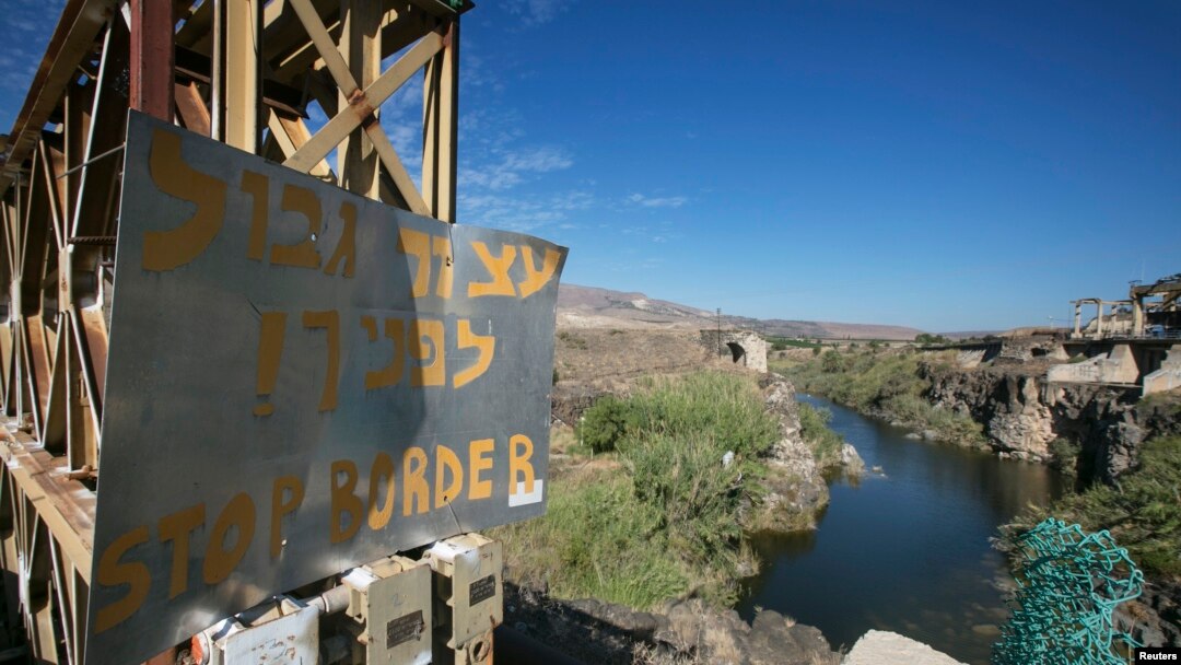 Warning sign on the Naharayim bridge spanning border of Israel and Jordan, north-eastern Israel, Oct. 22, 2014.