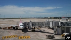 FILE - A plane stands parked at the Chinese-funded Siem Reap-Angkor International Airport, in Cambodia as it opened on November 16, 2023.